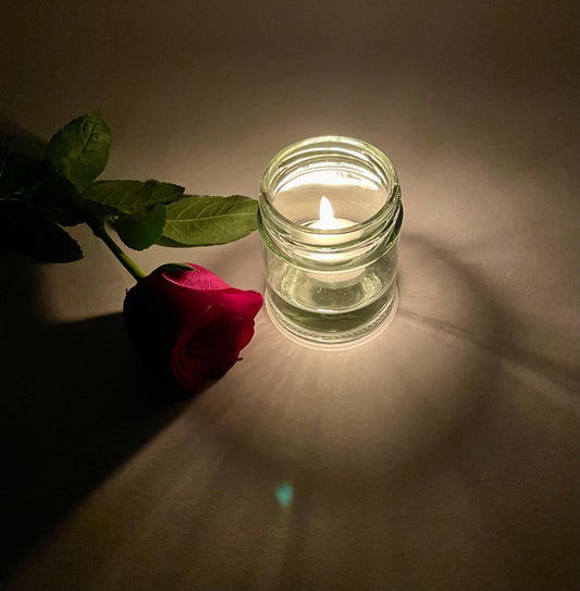 Beautiful tea light candle in a jar